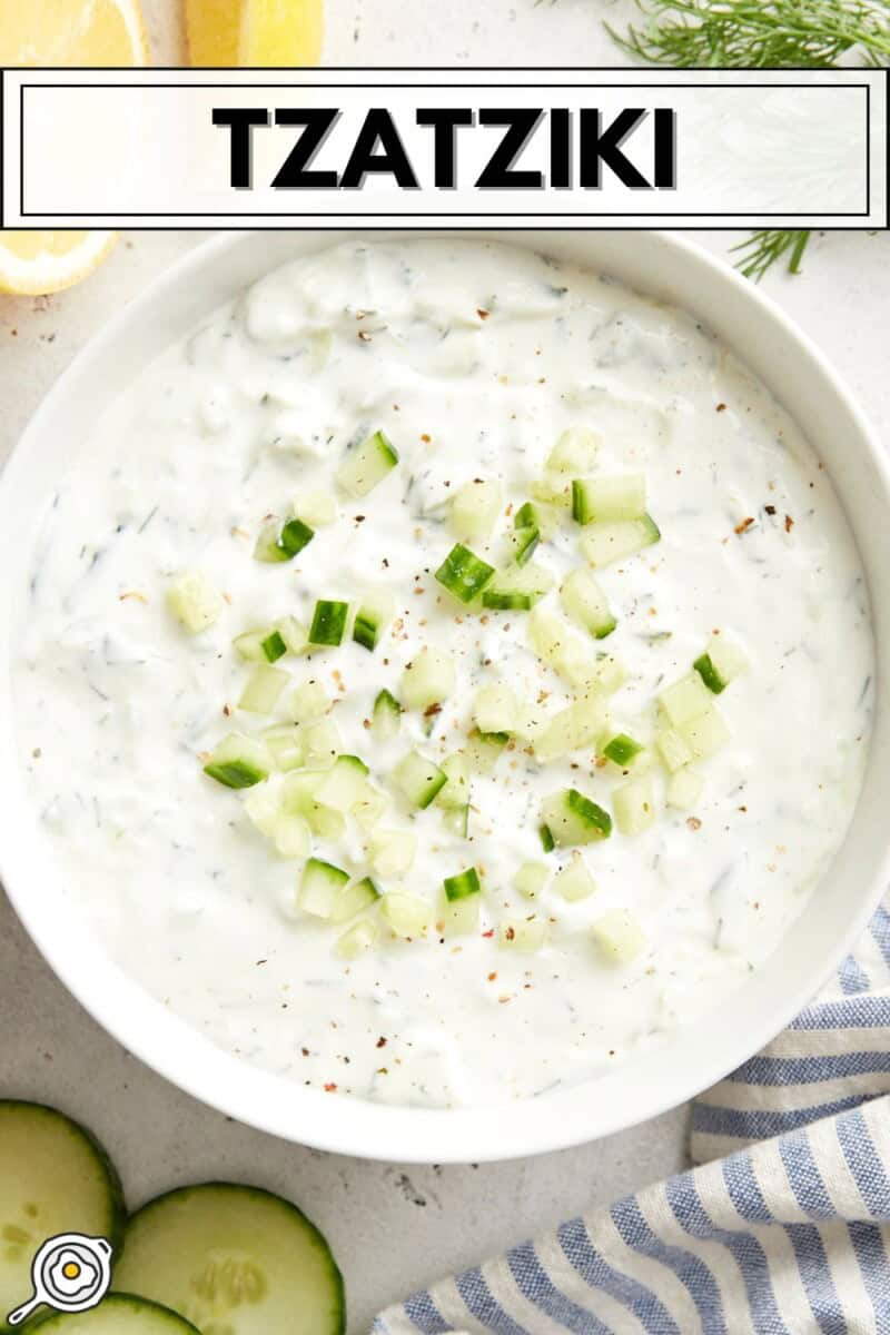 Overhead view of Tzatziki sauce in a white serving bowl with title text at the top.