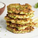 Front side view of a stack of zucchini fritters.