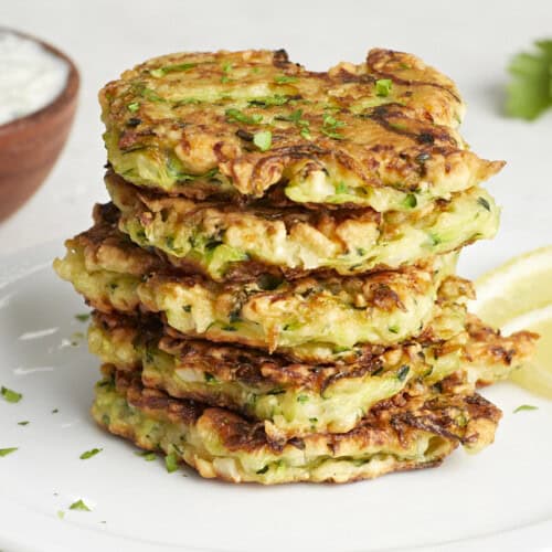Front side view of a stack of zucchini fritters.