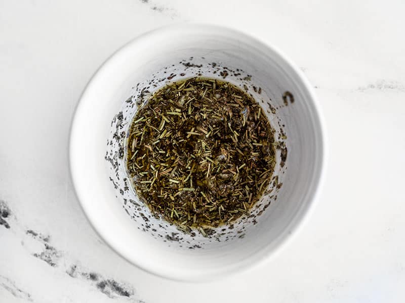 Garlic Herb Oil mixture in a small bowl