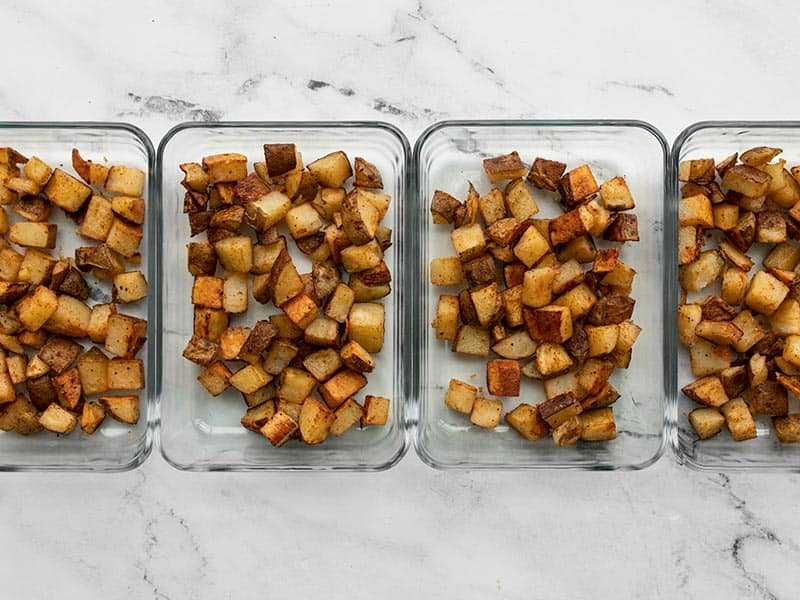 Roasted potatoes in rectangular glass meal prep containers
