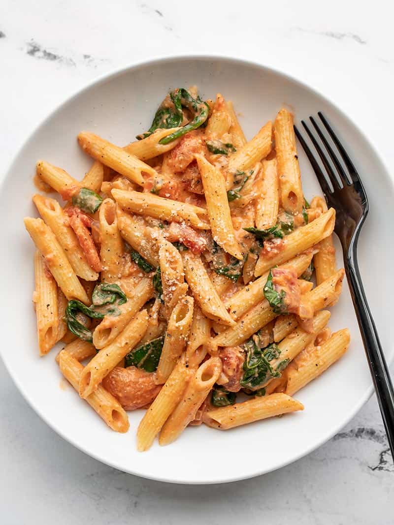 Easier than a box meal, this creamy tomato and spinach pasta is also ...