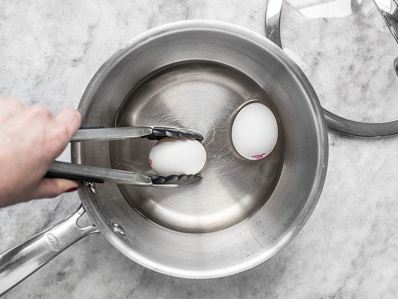 https://www.budgetbytes.com/wp-content/uploads/2014/02/Add-Eggs-to-Boiling-Water.jpg