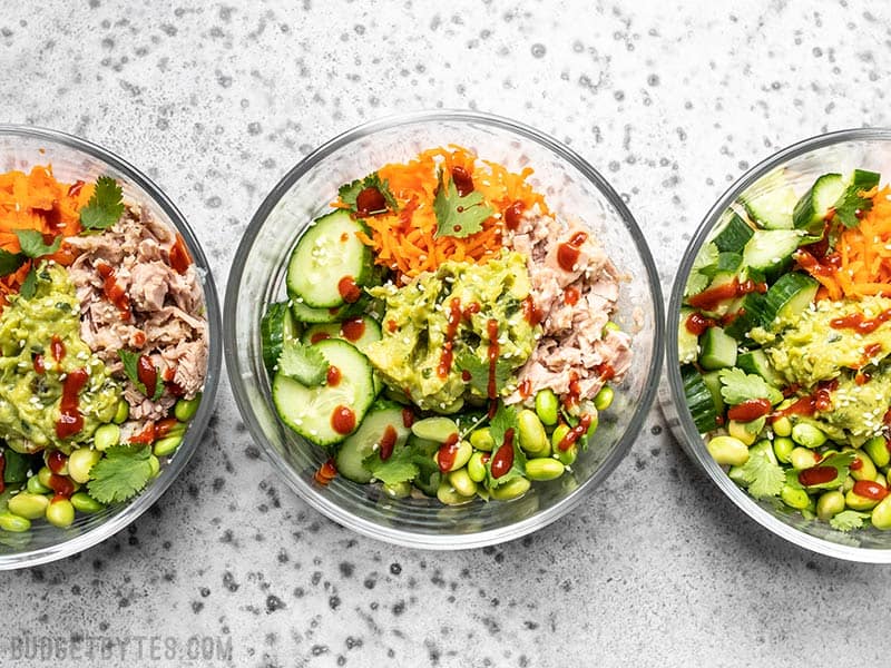 Meal prepped Spicy Tuna Guacamole Bowls in round glass containers