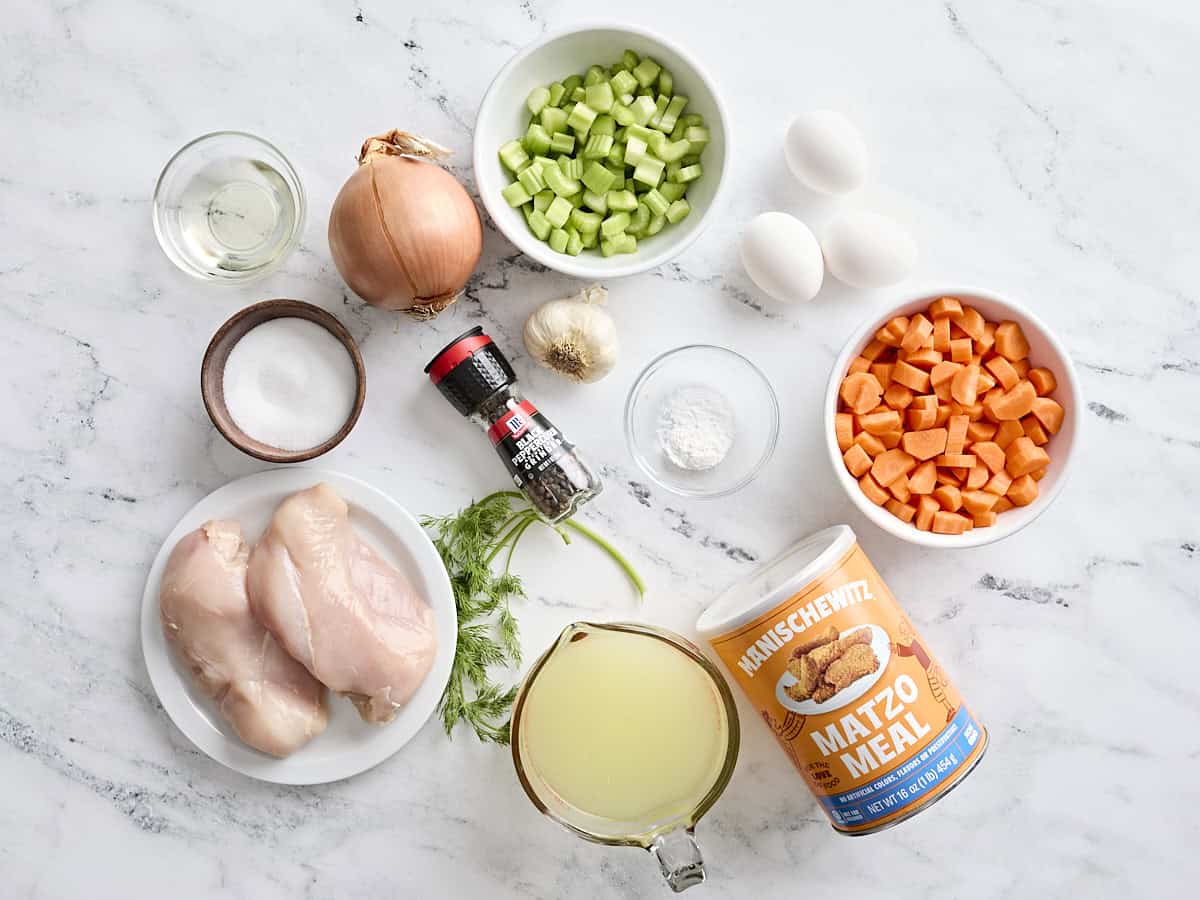 Overhead view of the ingredients for matzo ball soup.