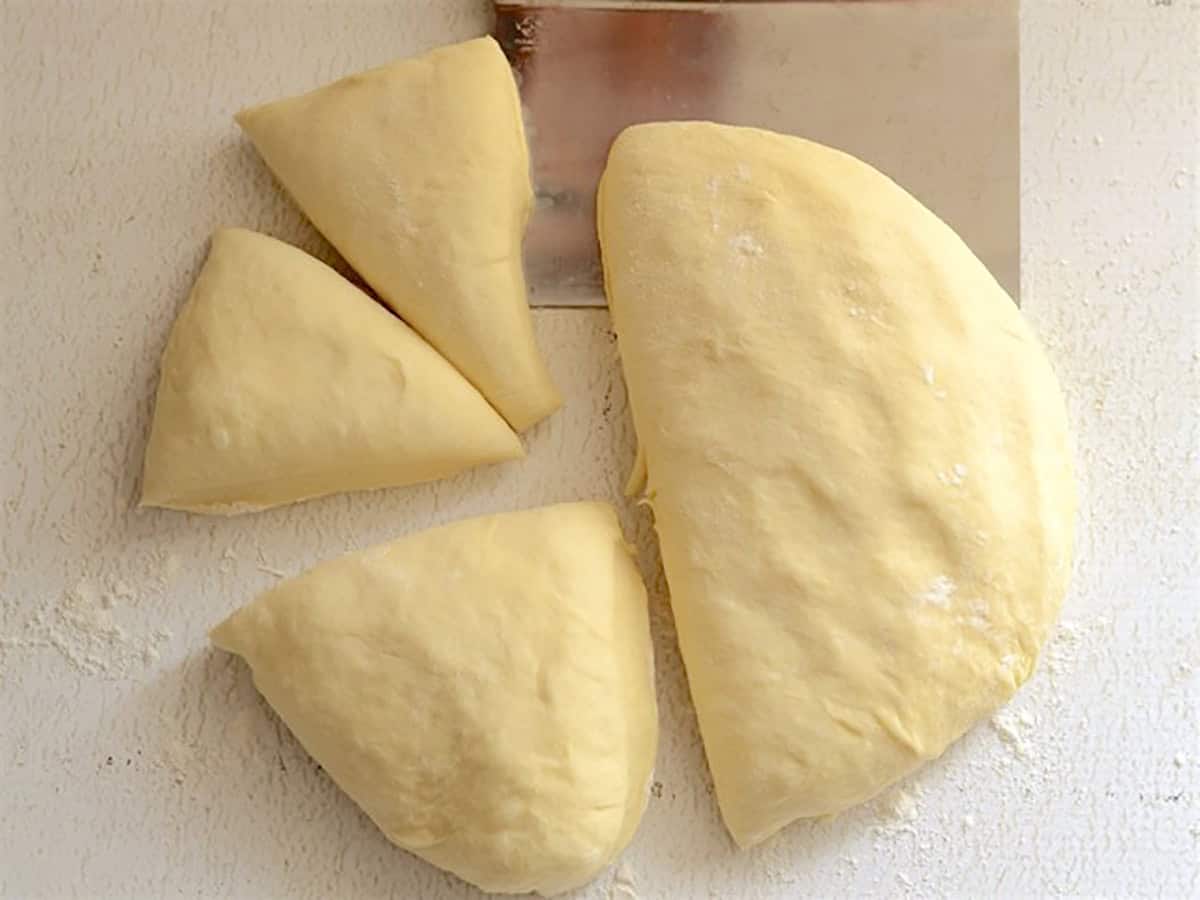 Naan dough cut into portions.