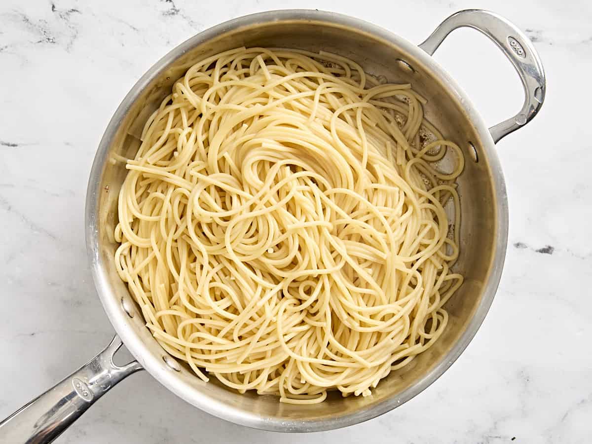 Cooked spaghetti in a skillet.