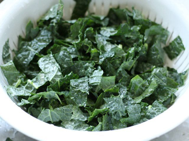 Rinse Kale in colander