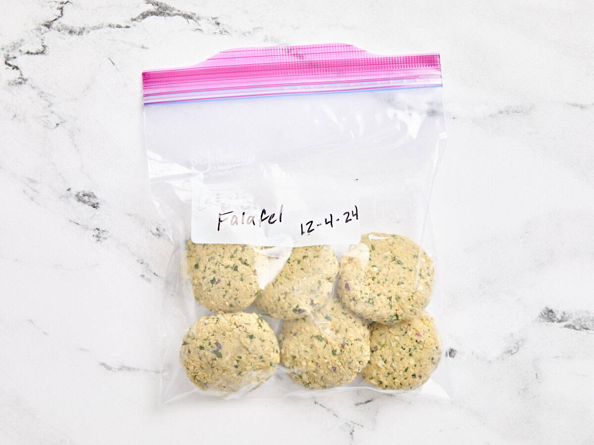 Falafel patties in a zip loc bag for freezing.