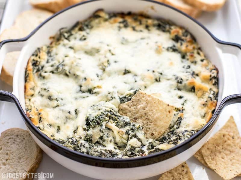 Double Spinach Artichoke Dip is PACKED with spinach, three types of cheese, and just enough spice to tingle your taste buds. BudgetBytes.com