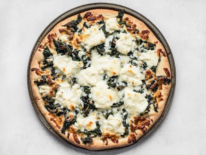 https://www.budgetbytes.com/wp-content/uploads/2018/05/Finished-Garlicky-Kale-and-Ricotta-Pizza.jpg
