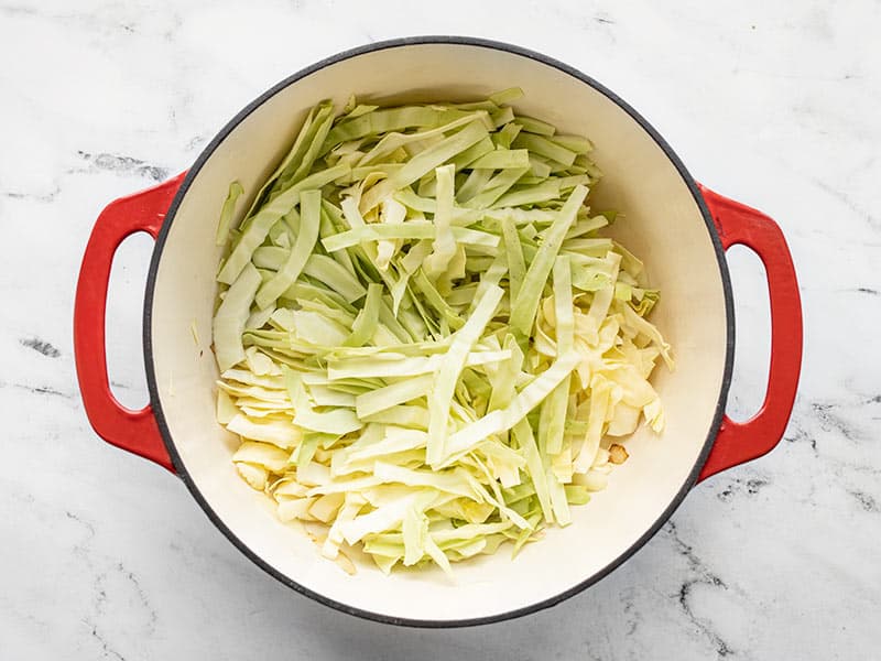Add sliced cabbage to the large pot