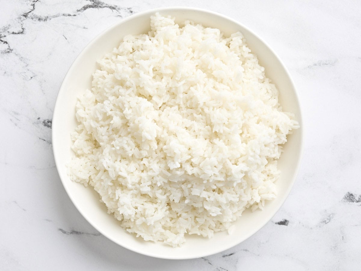 A plate of cooked white rice.