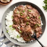 Overhead view of Louisiana red beans and rice on a plate with a fork.