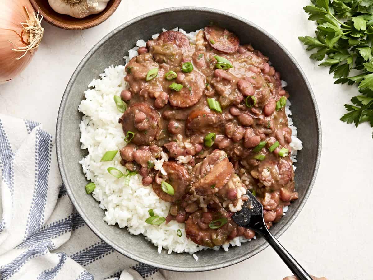 Overhead view of Louisiana red beans and rice on a plate with a fork.