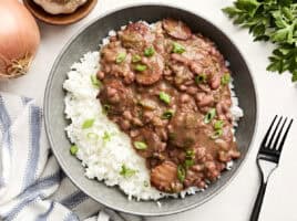 Overhead view of New Orleans-style red beans and rice on a plate.