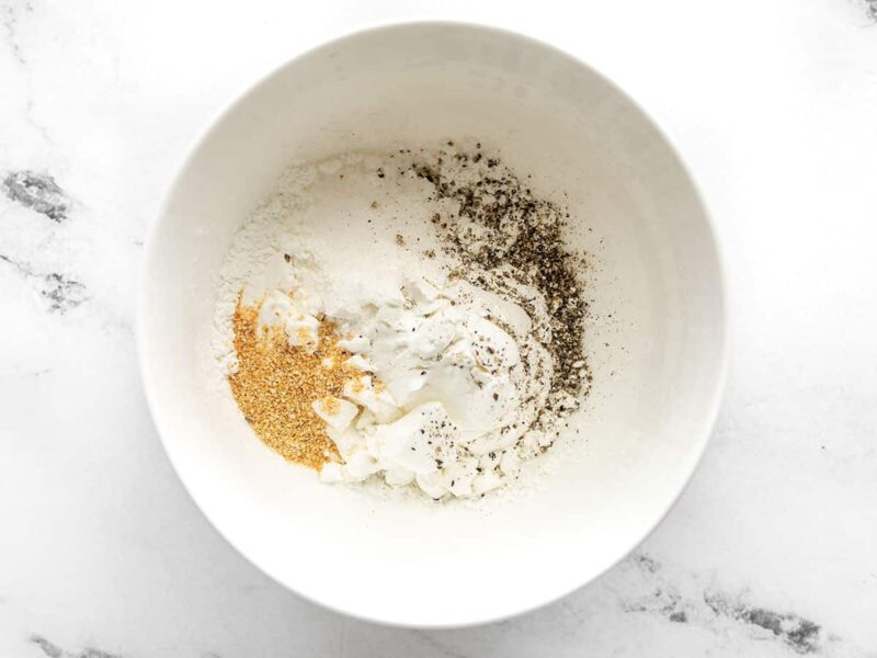 Cornstarch, salt, pepper, and garlic powder in a bowl