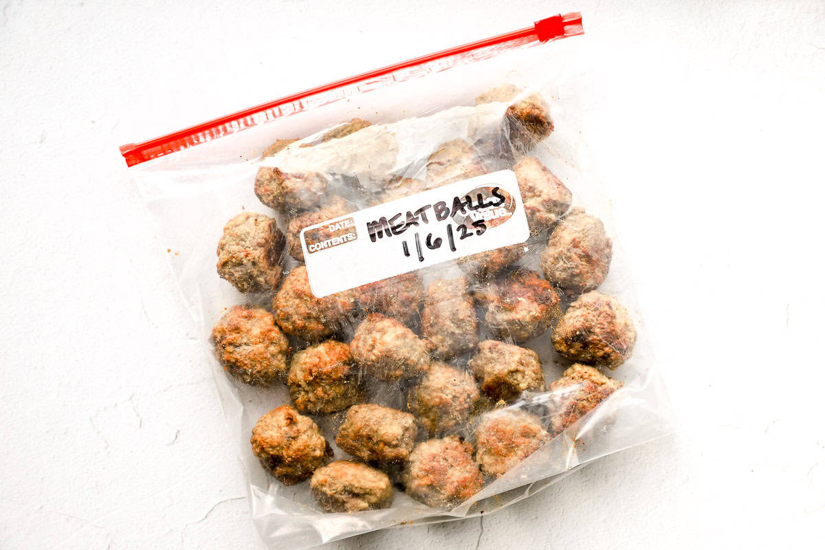 Cooked meatballs in a freezer bag.