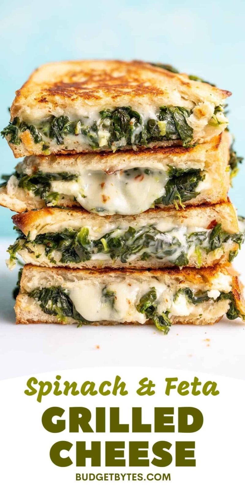 A stack of spinach and feta grilled cheeses