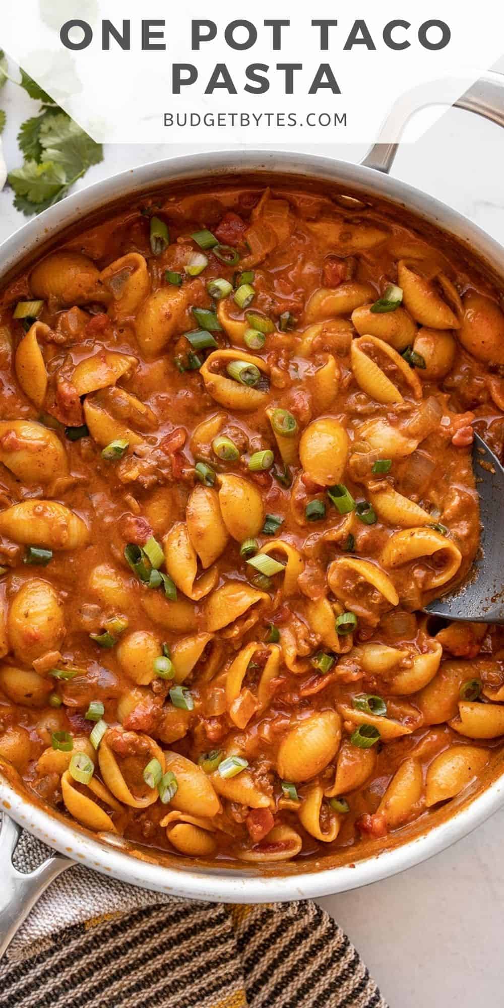 close up of beef taco pasta in the skillet, title text at the top.