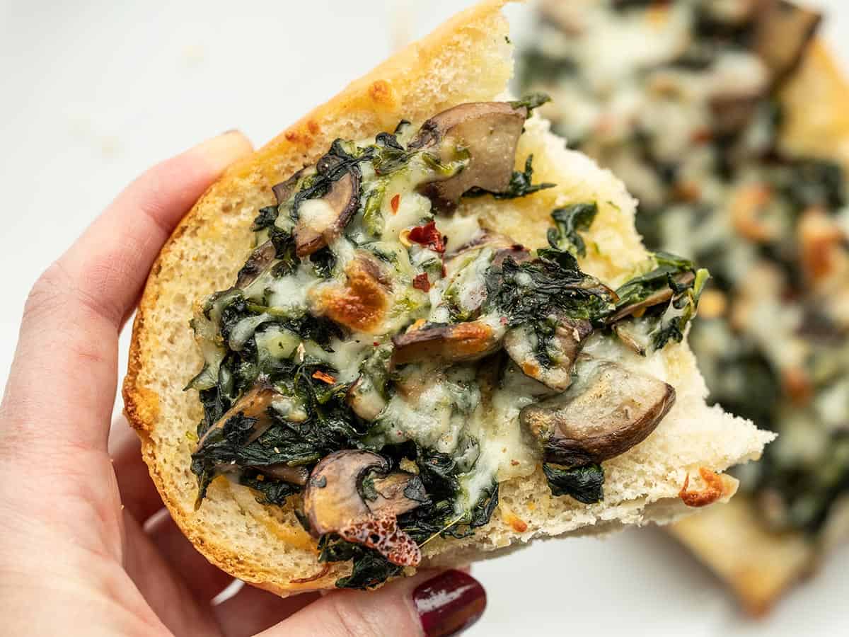 https://www.budgetbytes.com/wp-content/uploads/2022/04/Spinach-Mushroom-French-Bread-Pizzas-close.jpg
