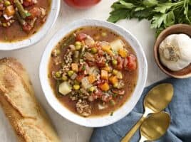 Overhead view of a bowl of vegetable beef soup.