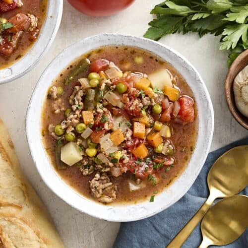 Overhead view of a bowl of vegetable beef soup.