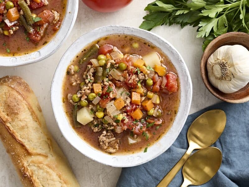 Overhead view of a bowl of vegetable beef soup.