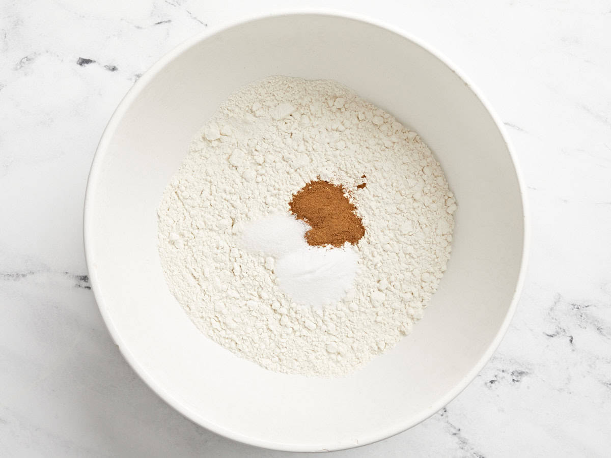 dry ingredients for banana cake in a white bowl.
