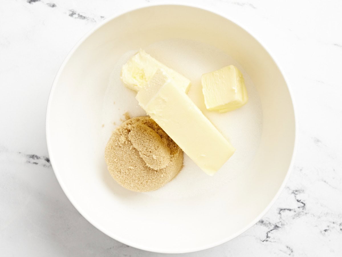 butter and sugars in a white bowl.
