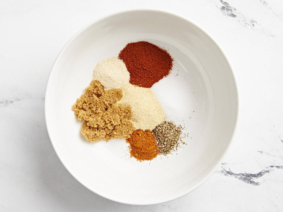 spices and brown sugar in a white bowl.