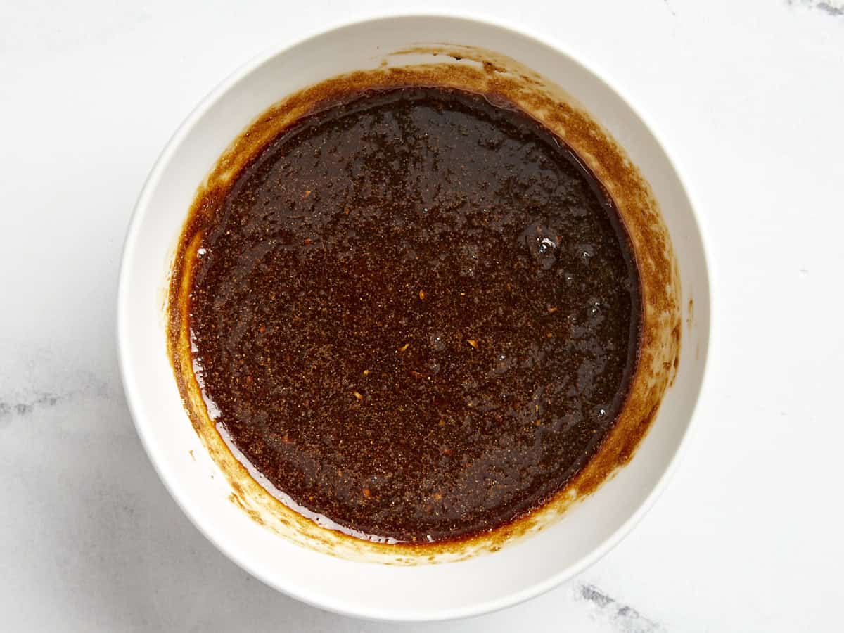 soy and brown sugar marinade in a white bowl.