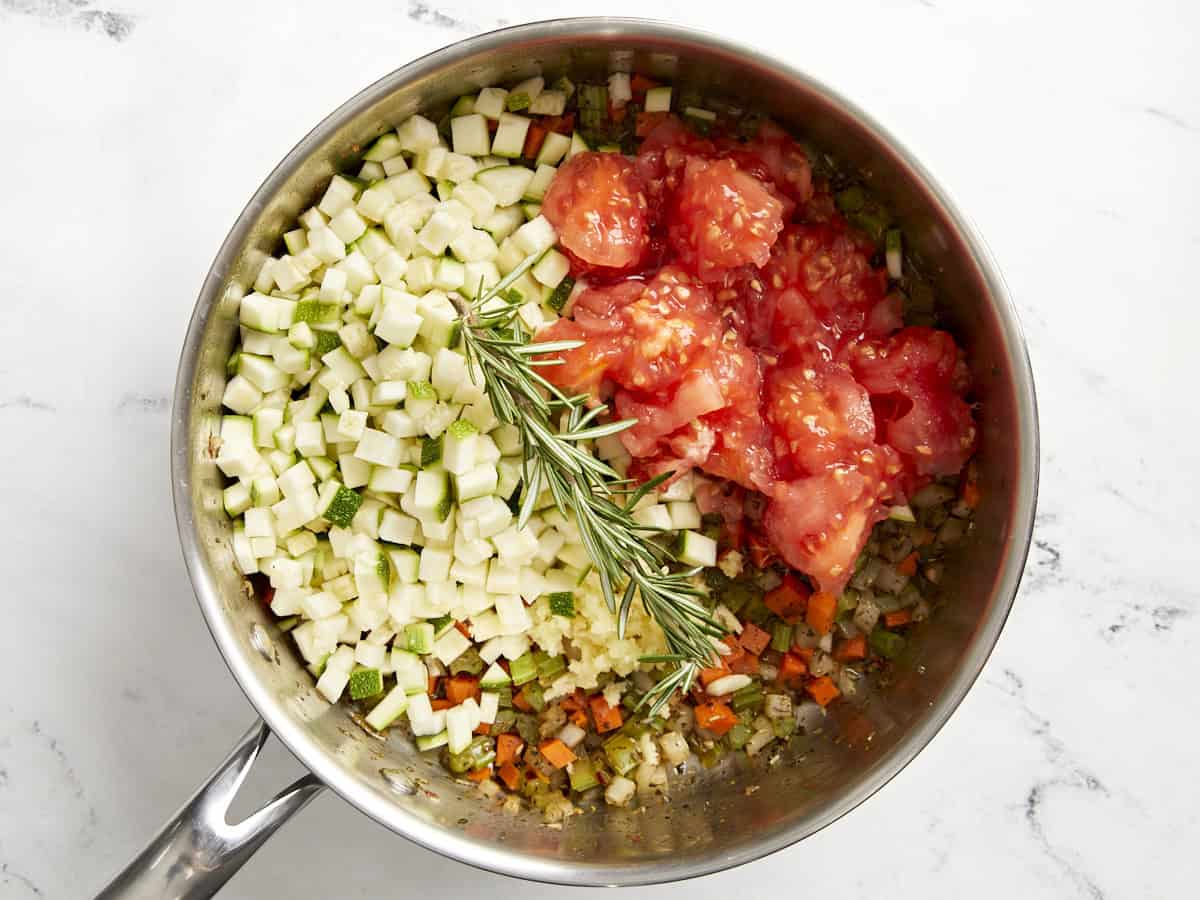 Filling for tuscan white bean stuffed tomatoes in a saucepan.