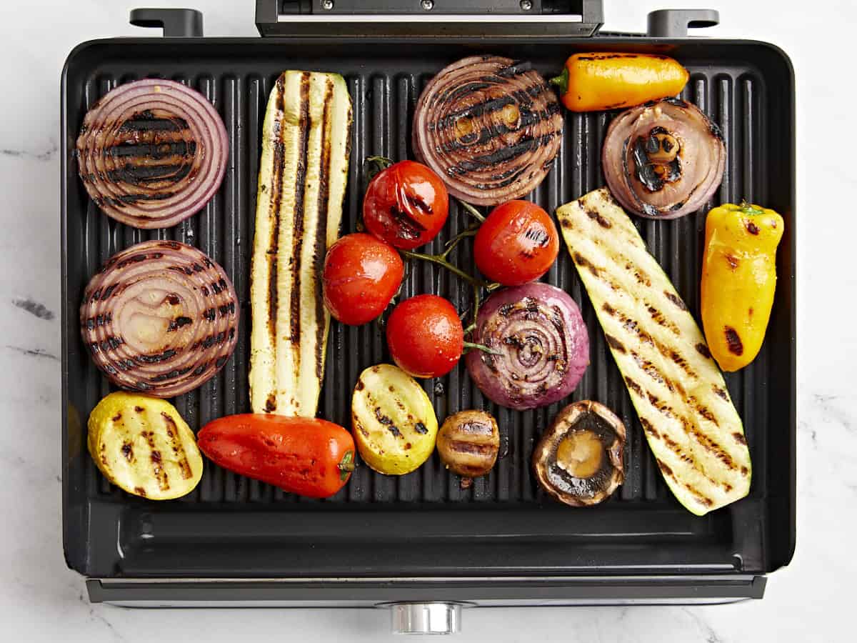 Overhead view of grilled vegetables on a grill.