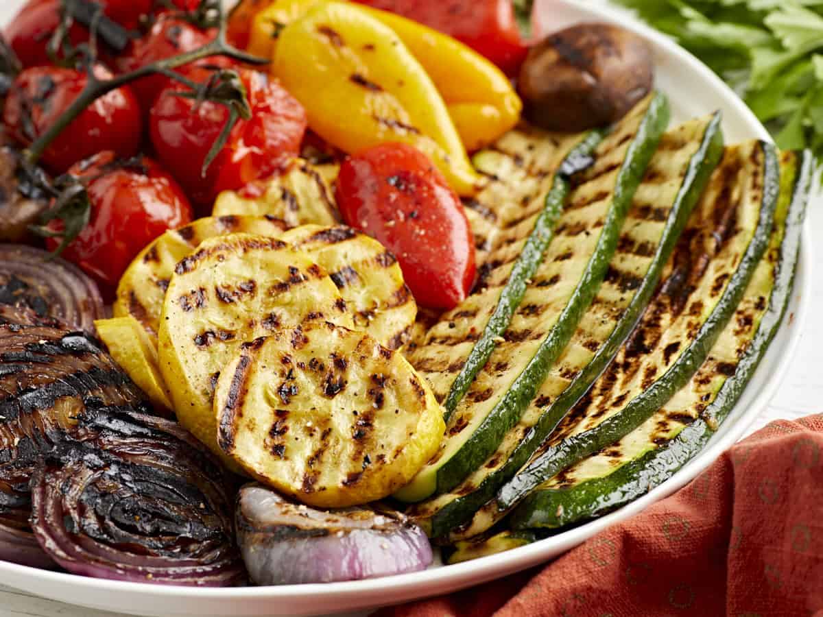 Side view of a plate of grilled vegetables.