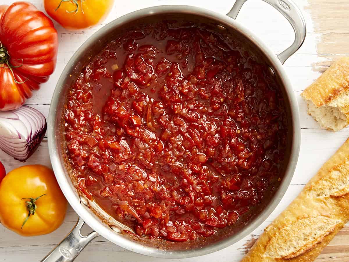 Overhead view of a skillet filled with tomato relish.