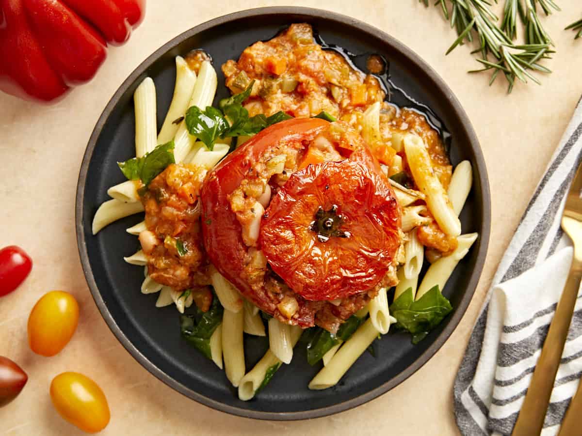 A tuscan white bean stuffed tomato with pasta.