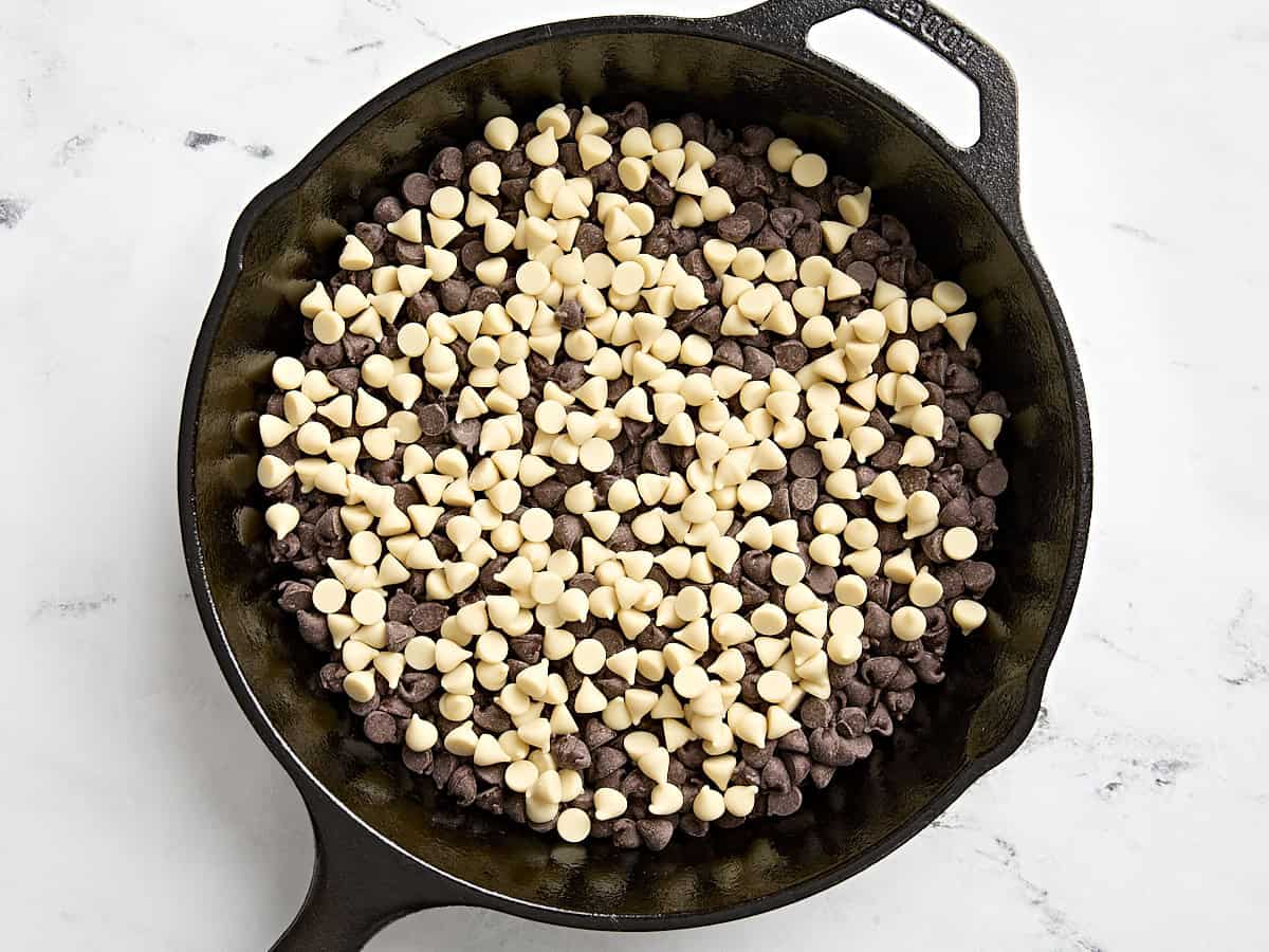 Semi-sweet and white chocolate chips in a skillet.