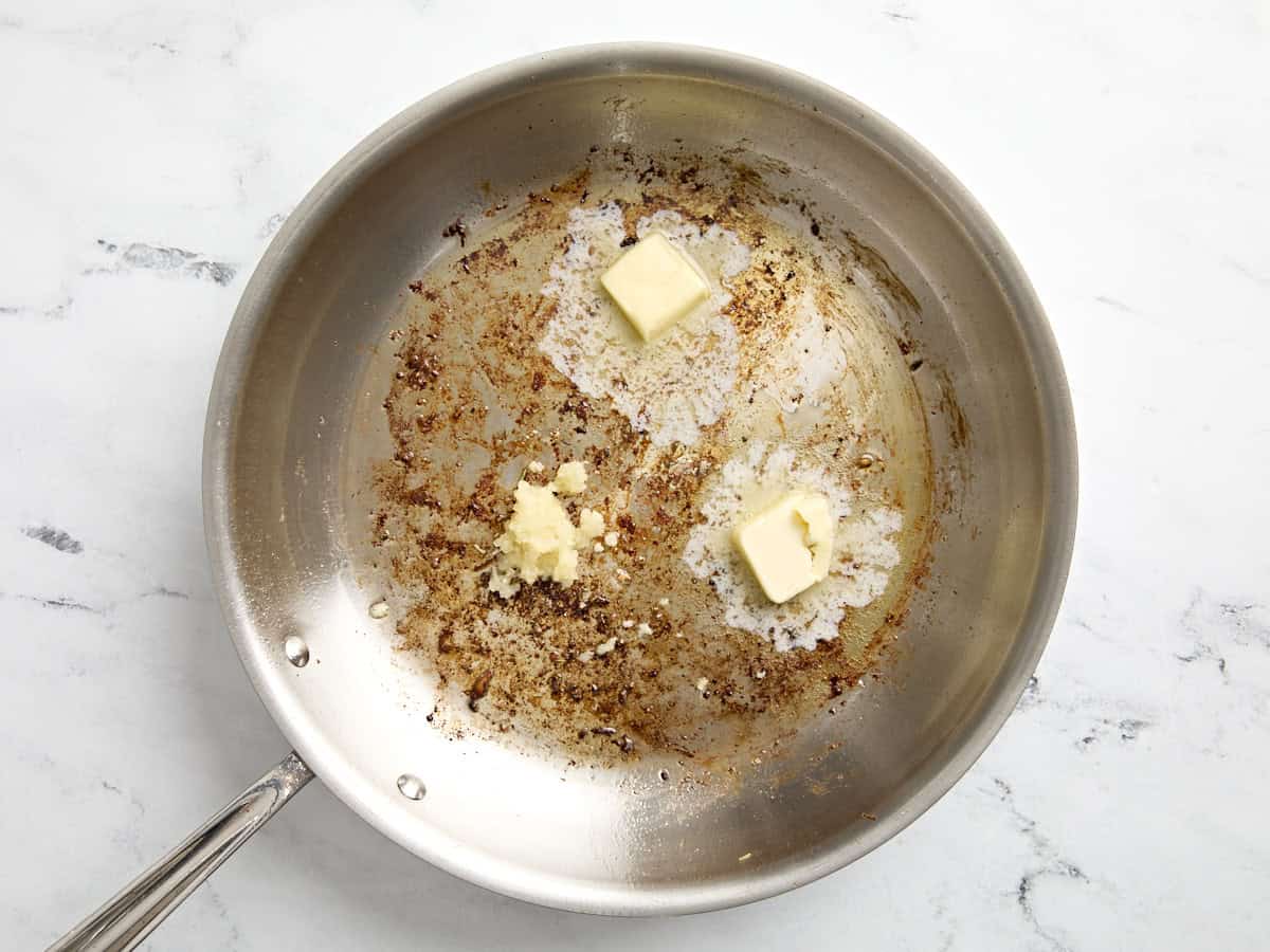 Butter and garlic added to large skillet.