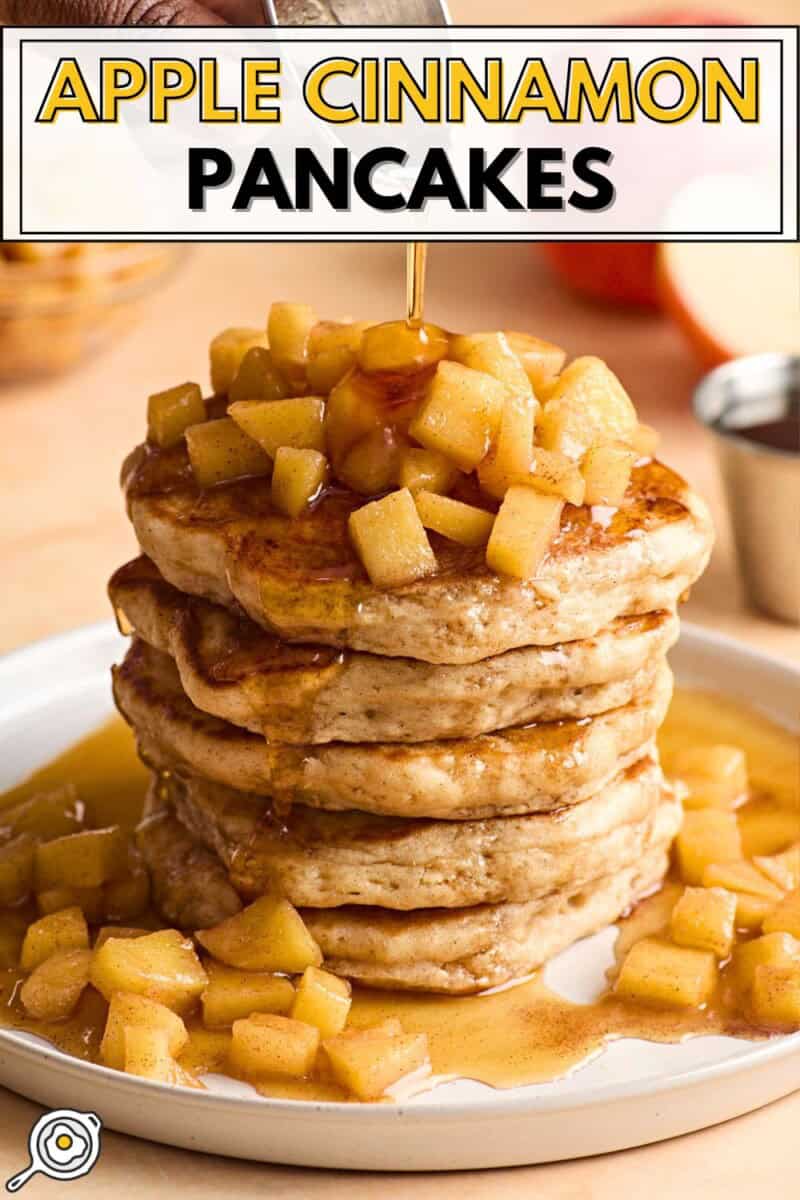 Front view of apple cinnamon pancakes with maple syrup being drizzled on top.