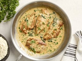 Overhead view of creamy dijon chicken in a skillet.