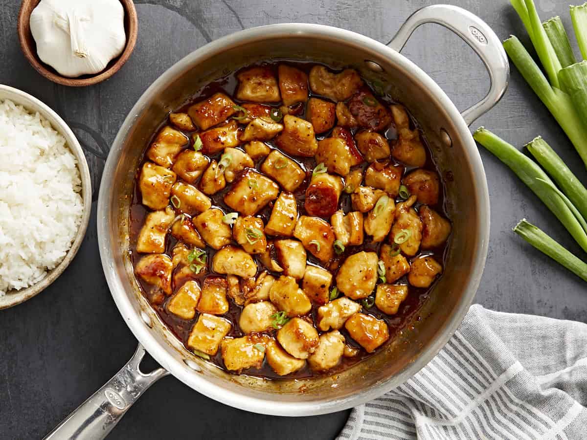 Overhead view of honey garlic chicken in a skillet.