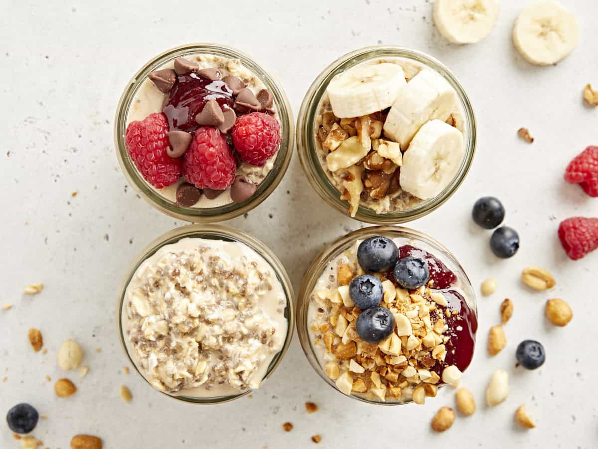 Overhead view of 4 mason jars filled with overnight oats