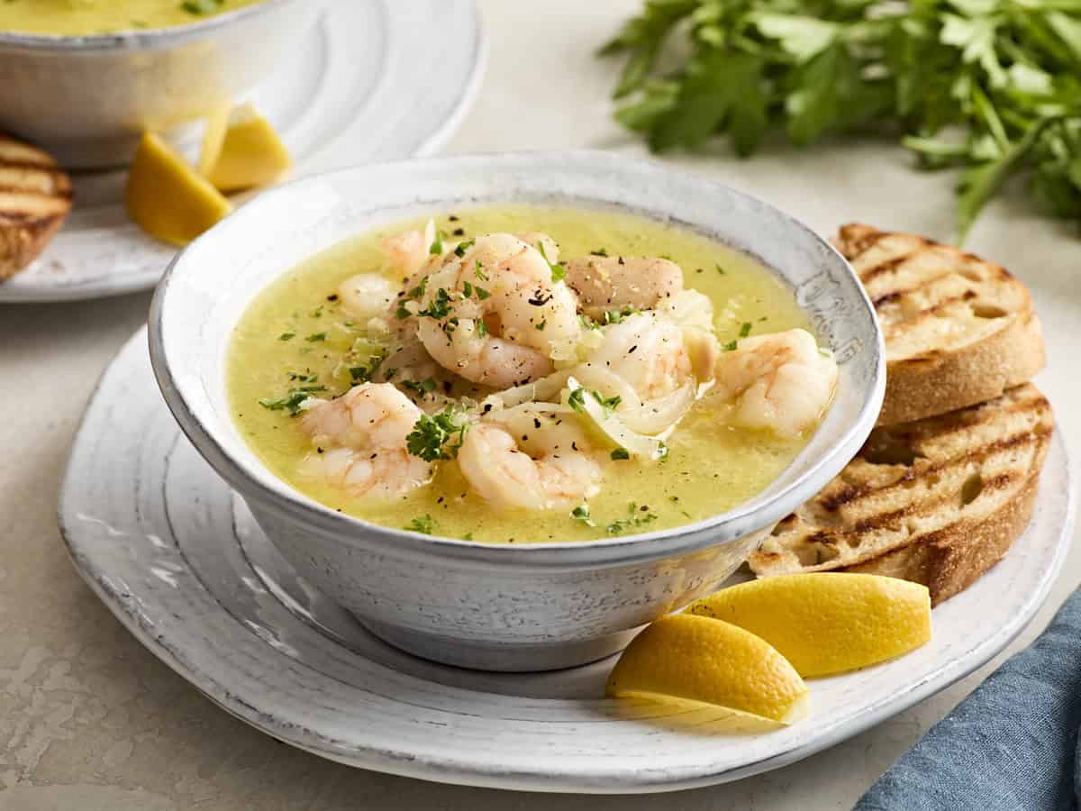 Side view of shrimp and white bean stew in a bowl 