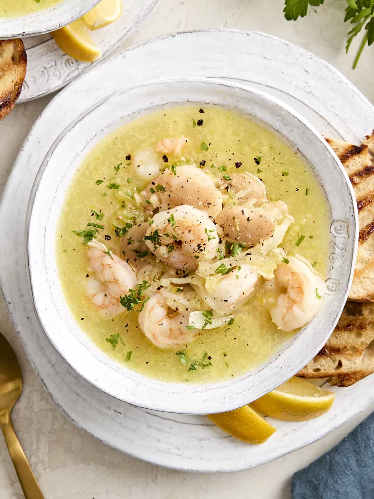 Overhead view of shrimp and white bean stew in a bowl