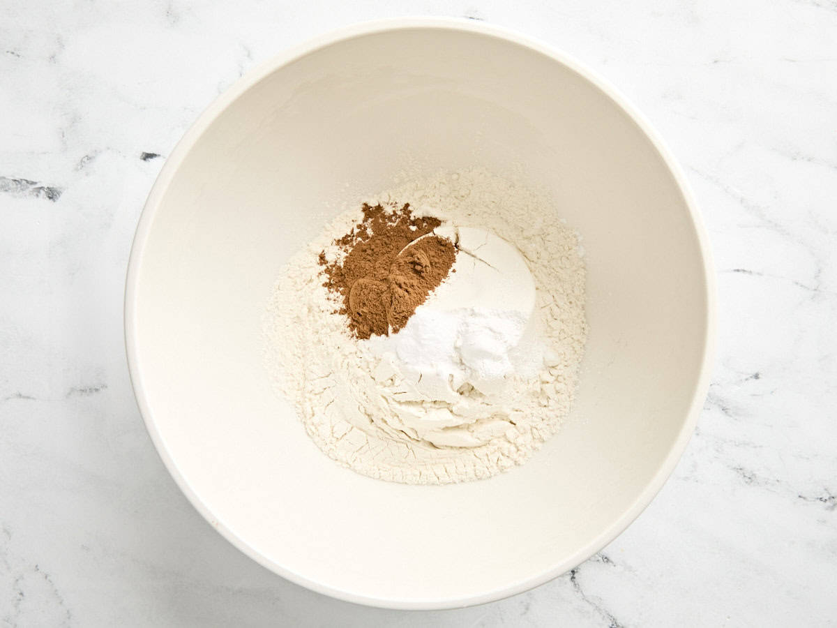 Dry ingredients for pumpkin cookies in a mixing bowl.