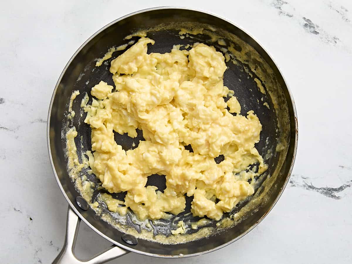 Scrambled eggs in a pan.