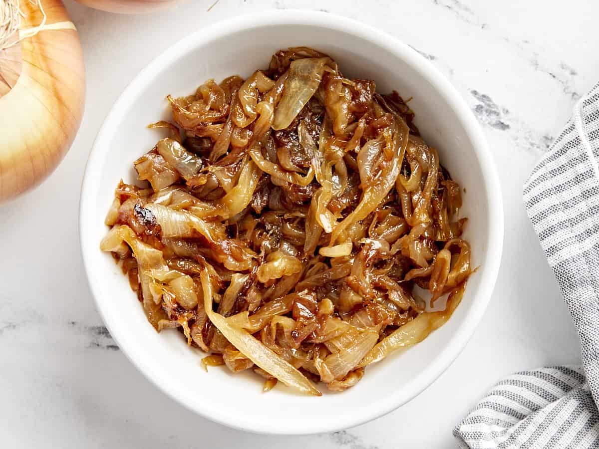 Caramelized onions in a white bowl.