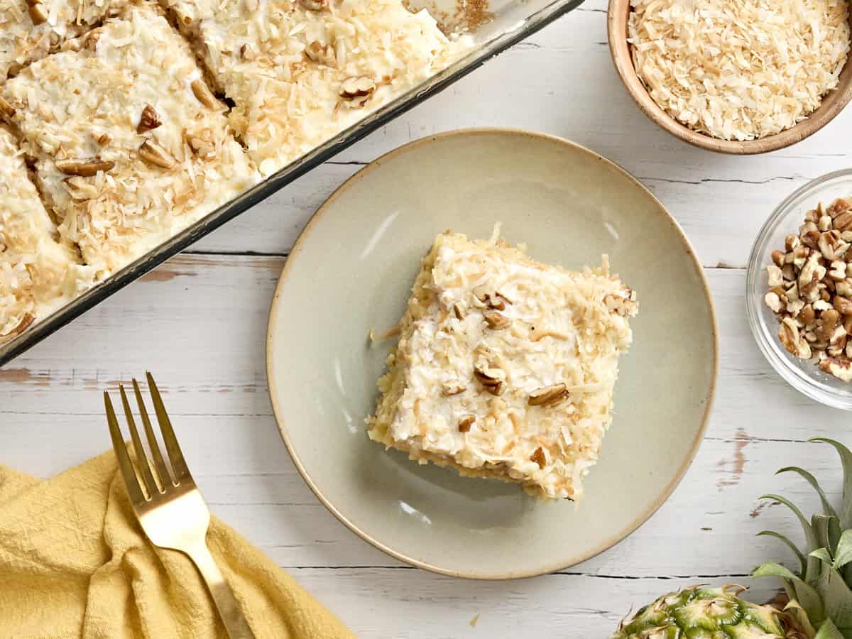 Overhead view of a slice of do nothing cake on a plate.