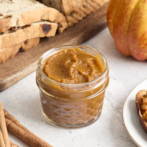 Side view of a jar of pumpkin butter.